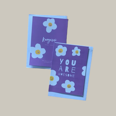 Two purple cards with floral designs and text on a beige background